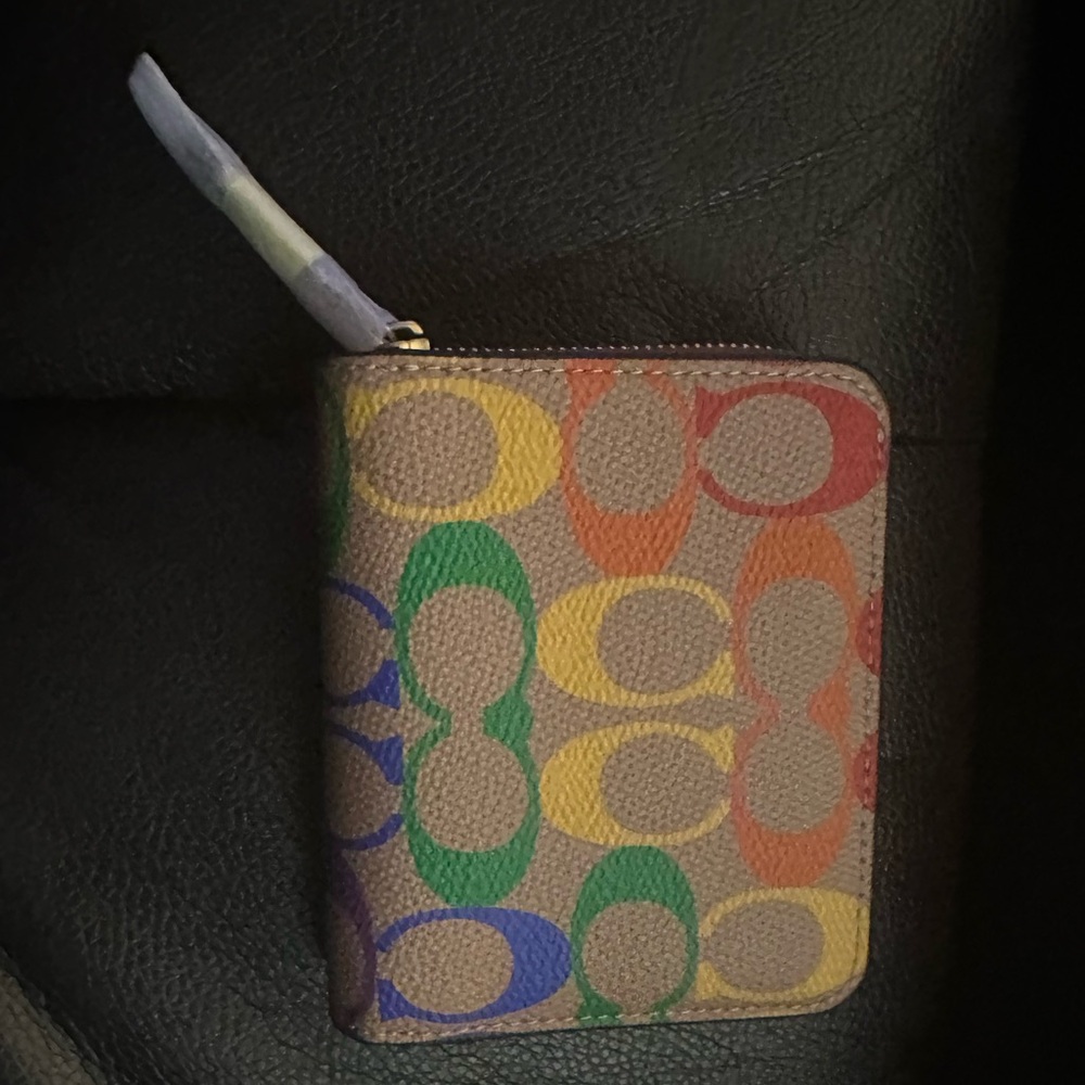 Coach Multicolor Signature Wallet Price Is
Firm.